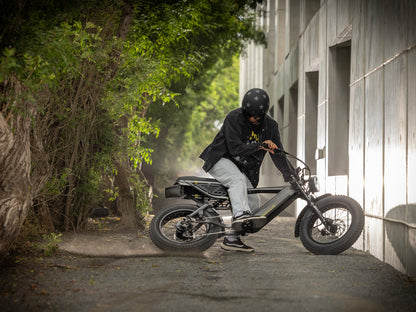Troxus Lynx 2-Up electric bike performing a controlled skid on a gravel trail 