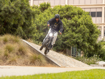 Troxus Lynx 2-Up electric bike cornering aggressively on a banked slope