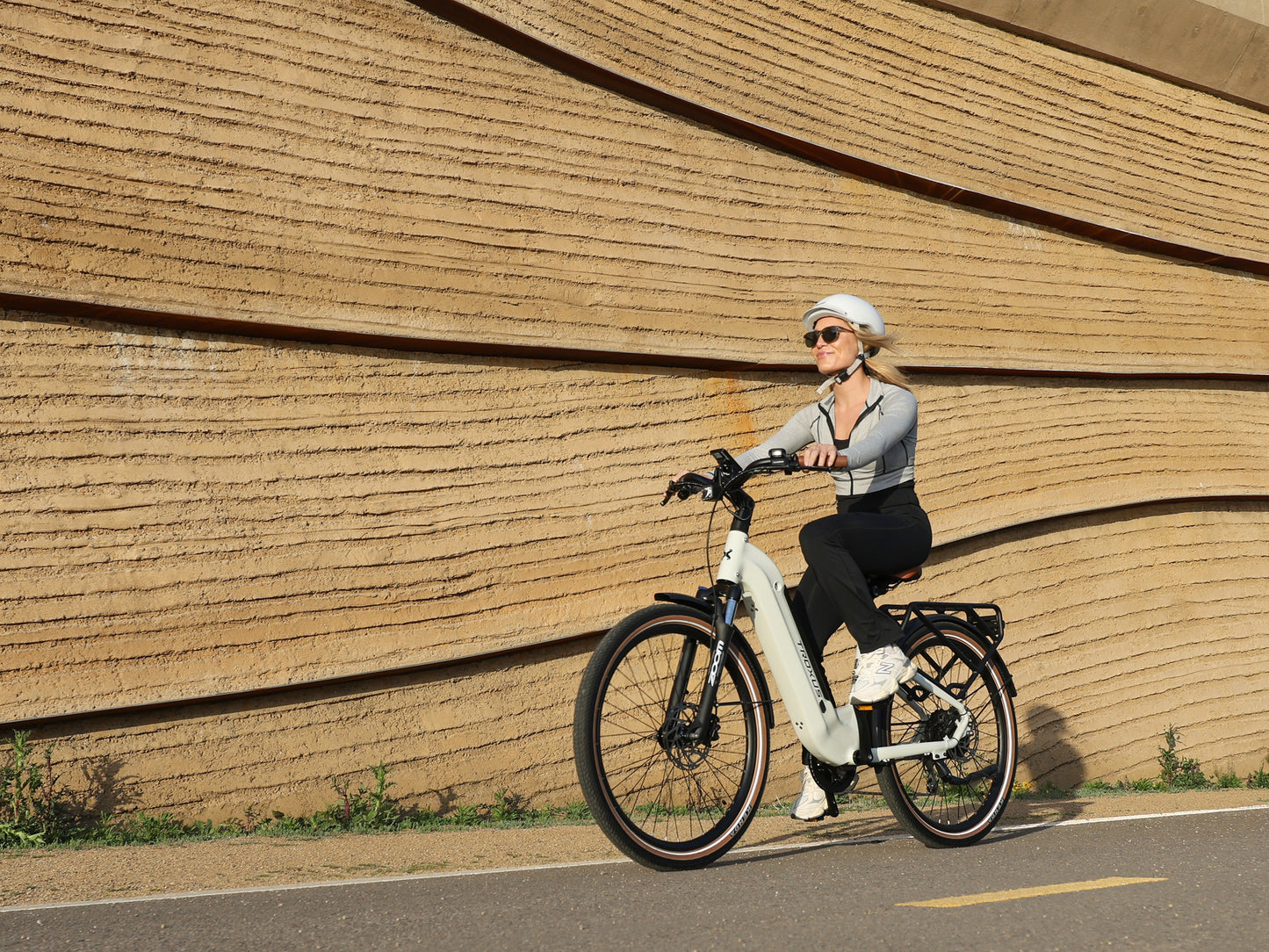 Troxus Trax Plus 500/15 Chalk Electric Bike Riding on an Urban Bike Path